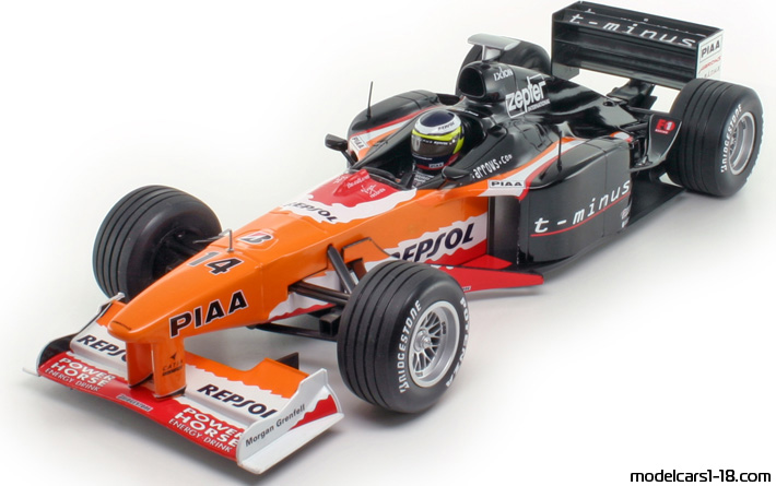 1999 - Arrows A20 Minichamps 1/18 (Оранжевый / Чёрный) Передняя левая сторона